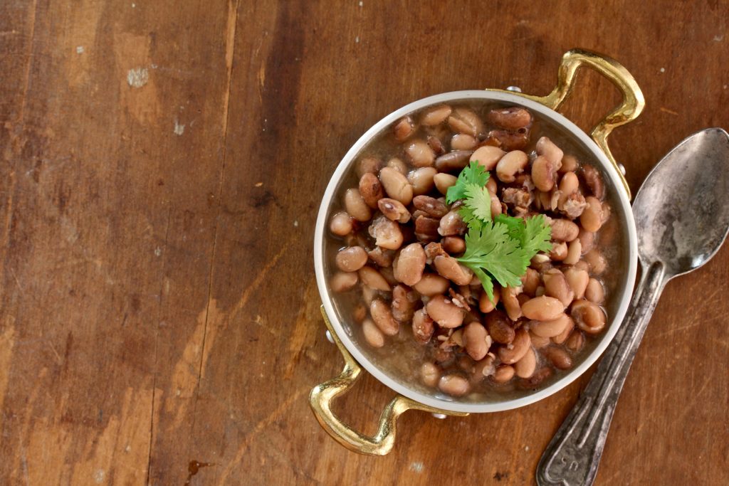 Boring beans? Not these Bacon Borracho Beans! Dry beans are transformed into something magical when infused with bacon and garlic! @cookinRD | sarahaasrdn.com